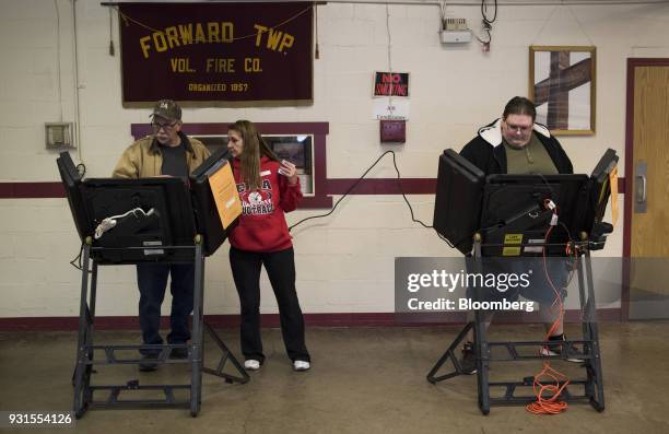 Residents cast votes at the Forward Township Volunteer Fire Department polling location in Forward Township, Pennsylvania, U.S., on March 13, 2018....