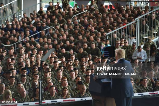 President Donald Trump speaks to military personnel at Marine Corps Air Station Miramar in San Diego, California on March 13, 2018. / AFP PHOTO /...