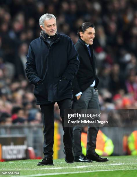Jose Mourinho, Manager of Manchester United and Vincenzo Montella manager of Sevilla smile on the touchline during the UEFA Champions League Round of...