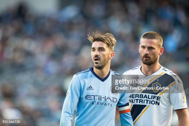 March 11: David Villa of New York City marked by Perry Kitchen of Los Angeles Galaxy during the New York City FC Vs LA Galaxy regular season MLS game...