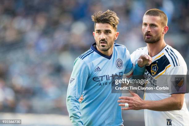 March 11: David Villa of New York City marked by Perry Kitchen of Los Angeles Galaxy during the New York City FC Vs LA Galaxy regular season MLS game...