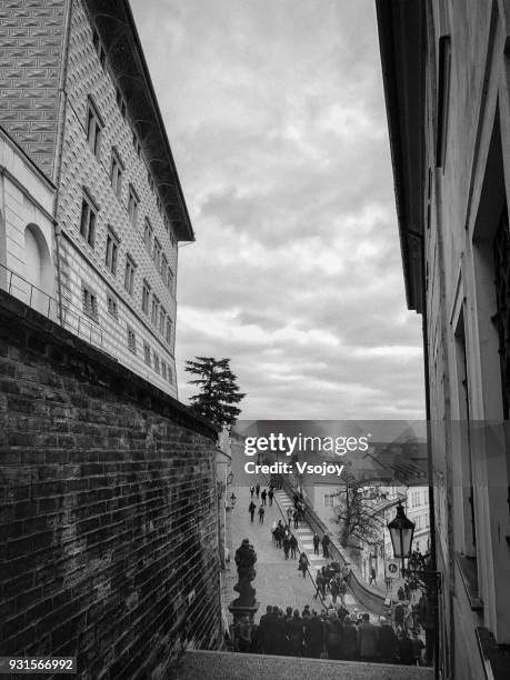 taking group photos on the street at lesser quarter (mala strana), prague, czech republic - vsojoy stockfoto's en -beelden