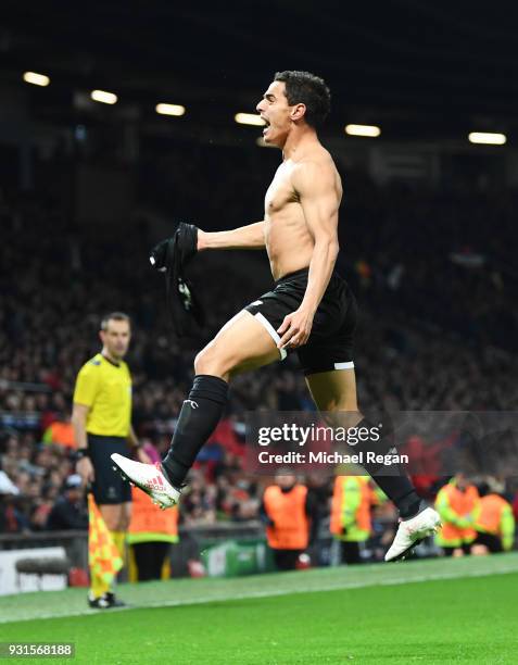 Wissam Ben Yedder of Sevilla celebrates as he scores their second goal during the UEFA Champions League Round of 16 Second Leg match between...