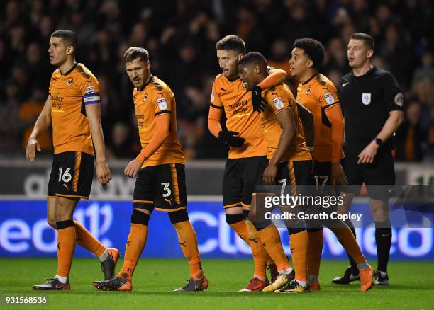 Matt Doherty of Wolverhampton Wanders is congratulated on scoring the third goal during the Sky Bet Championship match between Wolverhampton...