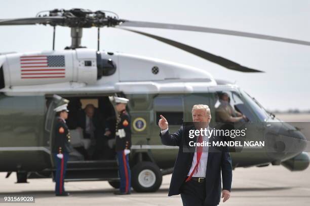 President Donald Trump gestures as he walks from Marine One to speak to military personnel at Marine Corps Air Station Miramar in San Diego,...