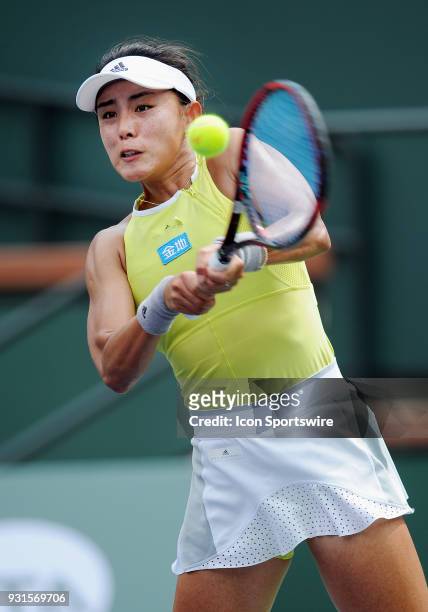 Tennis player Qiang Wang hits a backhand return in the second set of a match played at the BNP Paribas Open on March 13, 2018 at the Indian Wells...
