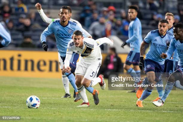 March 11: Daniel Steres of Los Angeles Galaxy challenged by Yangel Herrera of New York City and Ronald Matarrita of New York City during the New York...