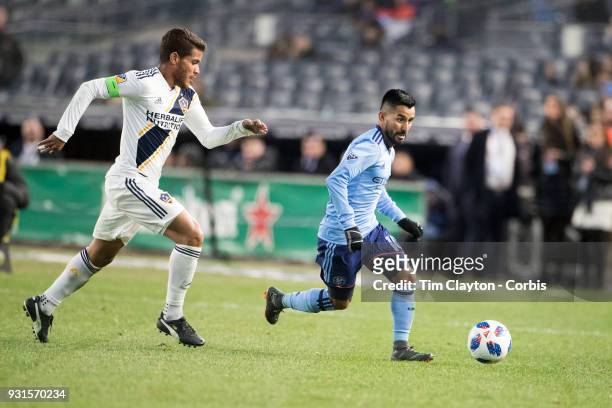 March 11: Maximiliano Moralez of New York City challenged by Jonathan dos Santos of Los Angeles Galaxy during the New York City FC Vs LA Galaxy...