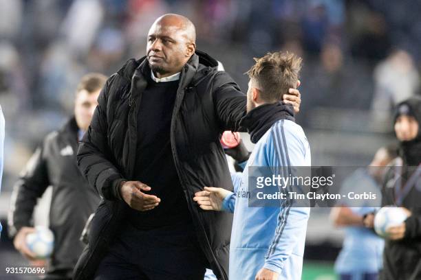 March 11: Patrick Vieira, head coach of New York City FC, congratulates David Villa of New York City at the end of the game during the New York City...