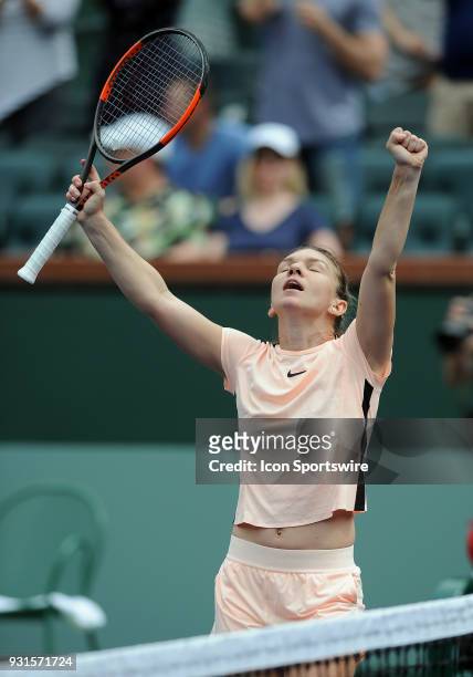 Tennis player Simona Halep reacts after defeating Qiang Wang in two sets of a match played at the BNP Paribas Open on March 13, 2018 at the Indian...