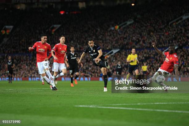 Wissam Ben Yedder of Sevilla scores their 1st goal during the UEFA Champions League Round of 16 Second Leg match between Manchester United and...