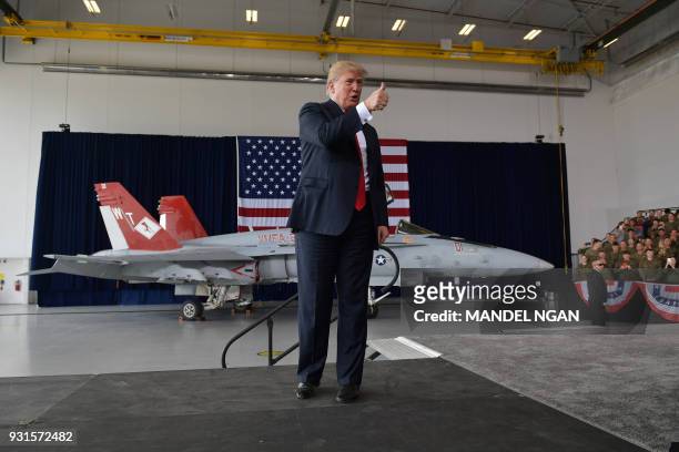 President Donald Trump gives the thumbs-up after speaking to military personnel at Marine Corps Air Station Miramar in San Diego, California on March...