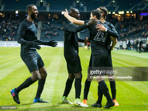 Tarik Elyounoussi of AIK celebrates scoring the opening goal with teammates Kristoffer Olsson, Enoch Kofi Adu, and Henok Goitom during a Swedish Cup...