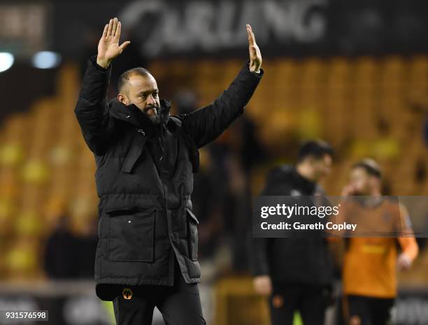 Nuno Espirito Santo of Wolverhampton Wanderers wave to the fans after victory in the Sky Bet Championship match between Wolverhampton Wanderers and...