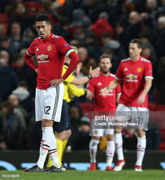 Chris Smalling of Manchester United walks off after the UEFA Champions League Round of 16 Second Leg match between Manchester United and Sevilla FC...