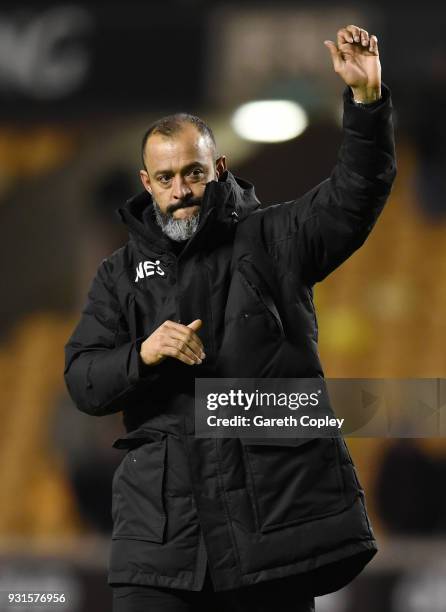 Nuno Espirito Santo of Wolverhampton Wanderers waves to the fans after victory in the Sky Bet Championship match between Wolverhampton Wanderers and...