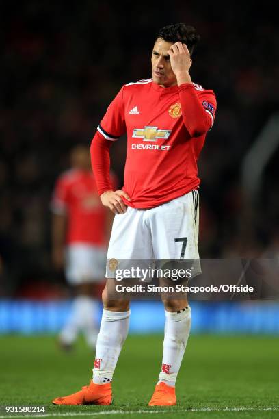 Alexis Sanchez of Man Utd looks dejected during the UEFA Champions League Round of 16 Second Leg match between Manchester United and Sevilla FC at...