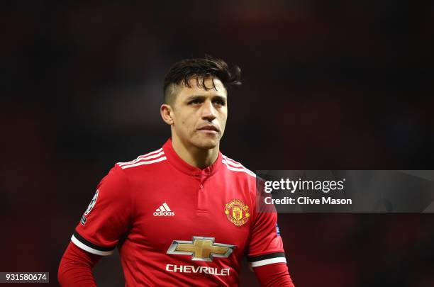 Alexis Sanchez of Manchester United looks dejected in defeat after the UEFA Champions League Round of 16 Second Leg match between Manchester United...