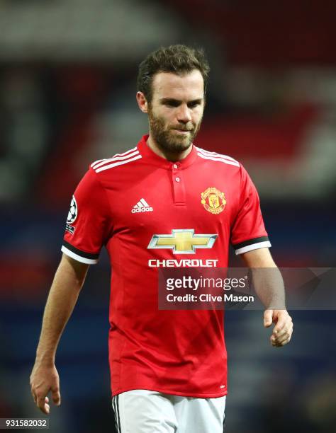 Juan Mata of Manchester United looks dejected in defeat after the UEFA Champions League Round of 16 Second Leg match between Manchester United and...