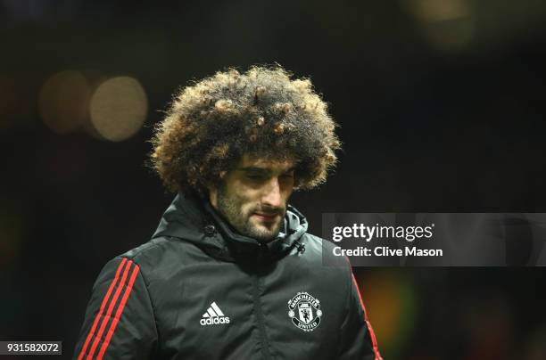 Marouane Fellaini of Manchester United looks dejected in defeat after the UEFA Champions League Round of 16 Second Leg match between Manchester...