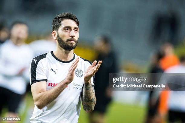 Nahir Besara of Orebro SK thanks the visiting supporters during a Swedish Cup quarter final match between AIK and Orebro SK at Friends arena on March...