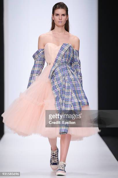 Model walks the runway during the KETIONE fashion show at Mercedes Benz Fashion Week Russia Fall/Winter 2018/19 at Manege on March 13, 2018 in...