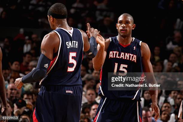 Josh Smith and Al Horford of the Atlanta Hawks celebrate a play during the game against the New York Knicks on November 11, 2009 at Madison Square...