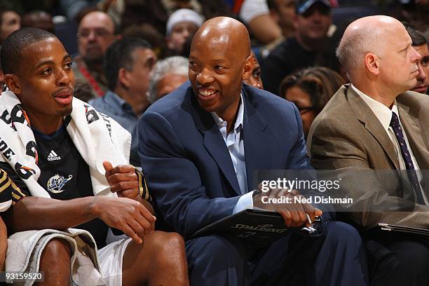 Assistant coach Sam Cassell and Randy Foye of the Washington Wizards talk on the bench during the game against the New Jersey Nets on October 31,...