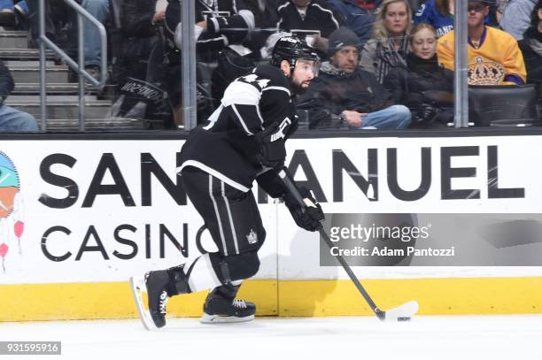 Nate Thompson of the Los Angeles Kings handles the puck during a game against the Vancouver Canucks at STAPLES Center on March 12, 2018 in Los...