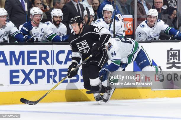 Trevor Lewis of the Los Angeles Kings handles the puck during a game against the Vancouver Canucks at STAPLES Center on March 12, 2018 in Los...
