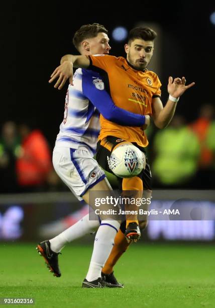 George Evans of Reading and Ruben Neves of Wolverhampton Wanderers during the Sky Bet Championship match between Wolverhampton Wanderers and Reading...