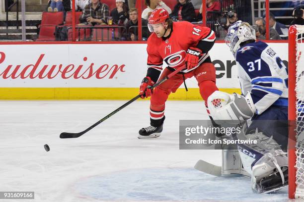 Carolina Hurricanes Right Wing Justin Williams waits for a pass in front of Winnipeg Jets Goalie Connor Hellebuyck during a game between the Winnipeg...