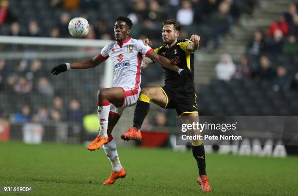 Ike Ugbo of Milton Keynes Dons contests the ball with Joe Mattock of Rotherham United during the Sky Bet League One match between Milton Keynes Dons...