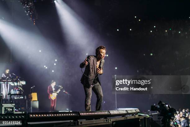 In this handout photo provided by Helene Marie Pambrun, Harry Styles performs during his European tour at AccorHotels Arena on March 13, 2018 in...