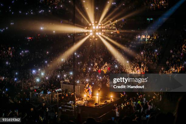 In this handout photo provided by Helene Marie Pambrun, Harry Styles performs during his European tour at AccorHotels Arena on March 13, 2018 in...