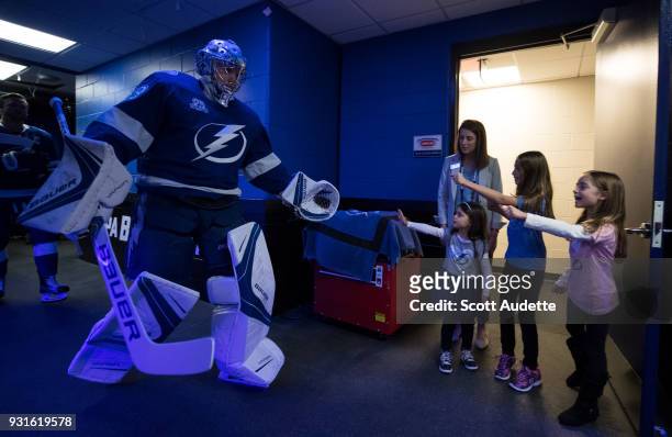 Goalie Andrei Vasilevskiy of the Tampa Bay Lightning is greeted by fans as he walks to the ice against the Ottawa Senators during the pregame warm...