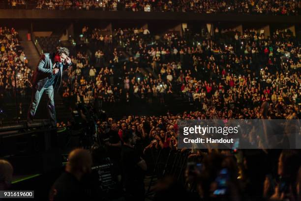 In this handout photo provided by Helene Marie Pambrun, Harry Styles performs during his European tour at AccorHotels Arena on March 13, 2018 in...
