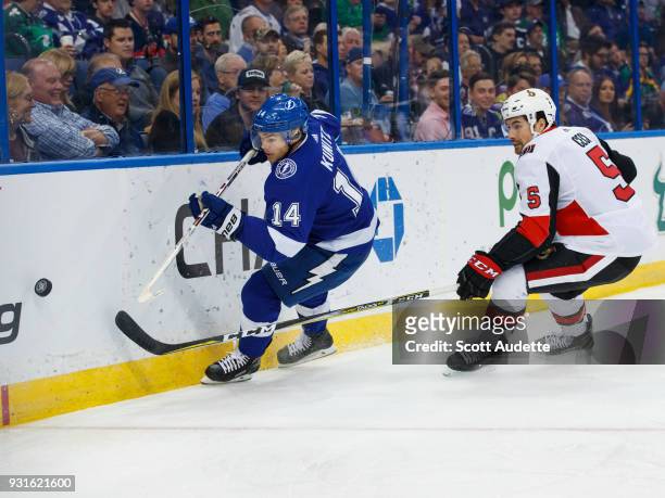Chris Kunitz of the Tampa Bay Lightning skates against Cody Ceci of the Ottawa Senators during the first period at Amalie Arena on March 13, 2018 in...