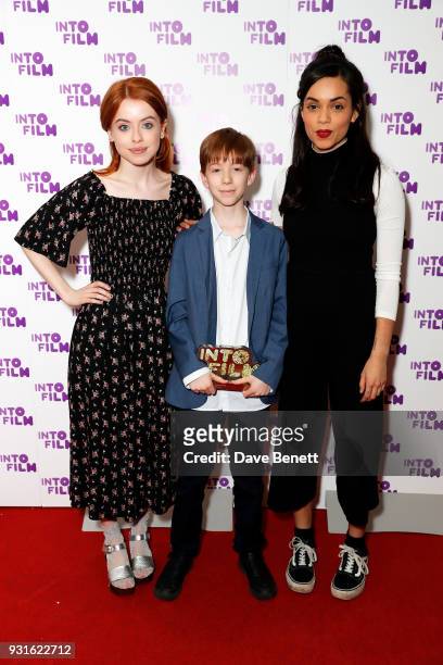 Rosie Day and Georgina Campbell alongside Jude from London with the Best Animation award for 'Ashta and the Dragon' at the INTO Film Awards at BFI...