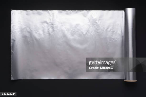 roll of aluminium foil - aluminium foil stock pictures, royalty-free photos & images