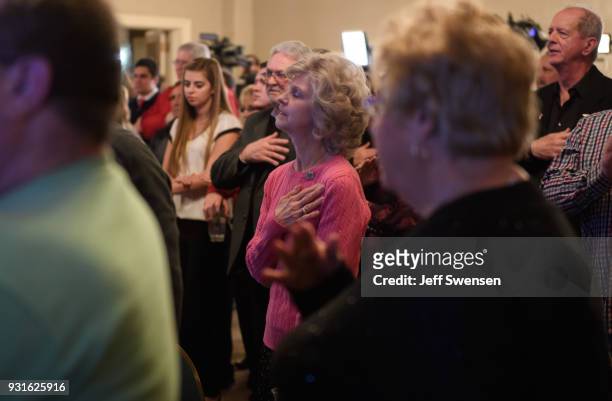 Election night supporters sing the National Anthem at an event for GOP PA Congressional Candidate Rick Saccone as the polls close on March 13, 2018...