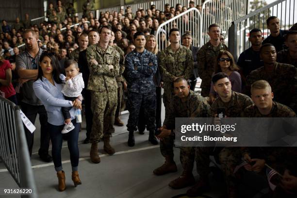 Attendees listen during an event with U.S. President Donald Trump, not pictured, at Marine Corps Air Station Miramar in San Diego, California, U.S.,...