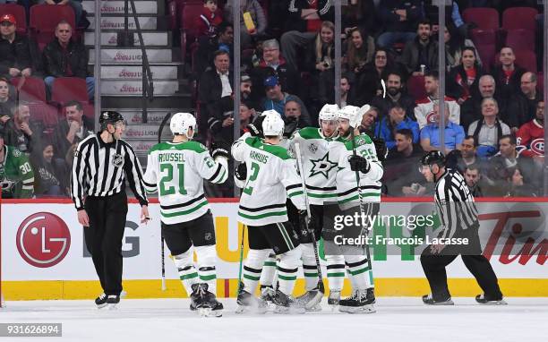 Radek Faksa of the Dallas Stars celebrates with teammates after scoring a goal against the Montreal Canadiens in the NHL game at the Bell Centre on...