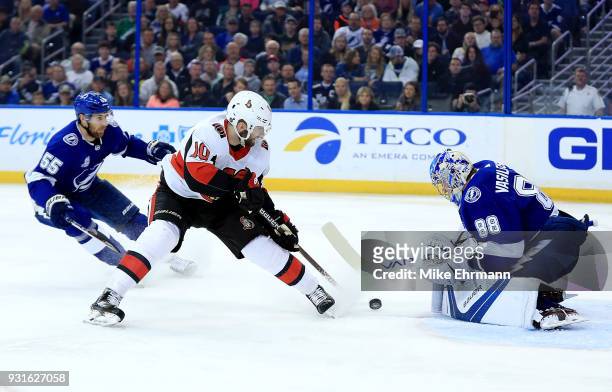 Andrei Vasilevskiy of the Tampa Bay Lightning stops a shot from Tom Pyatt of the Ottawa Senators during a game at Amalie Arena on March 13, 2018 in...