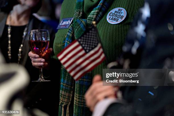 An attendee wears a "We Want Conor Lamb" button during an election night rally for Conor Lamb, Democratic candidate for the U.S. House of...