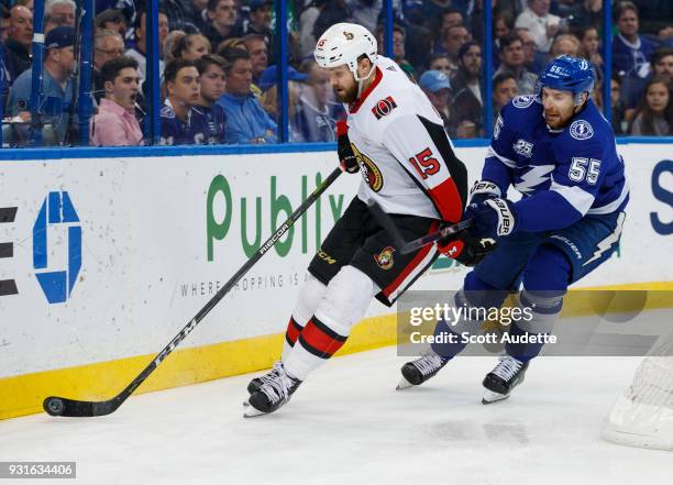 Braydon Coburn of the Tampa Bay Lightning skates against Zack Smith of the Ottawa Senators during the second period at Amalie Arena on March 13, 2018...