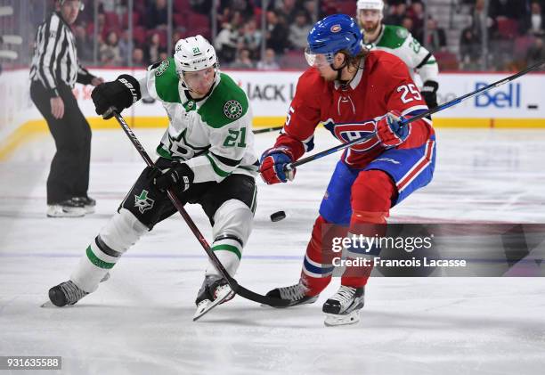 Jacob De La Rose of the Montreal Canadiens defends against Antoine Roussel of the Dallas Stars in the NHL game at the Bell Centre on March 13, 2018...