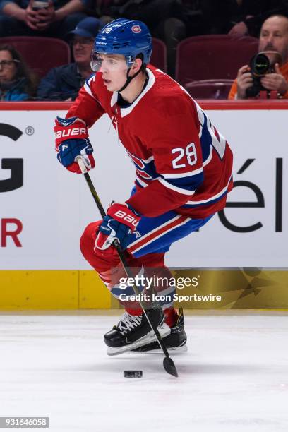 Montreal Canadiens defenseman Mike Reilly skates with the puck during the second period of the NHL game between the Dallas Stars and the Montreal...