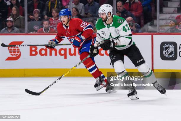 Montreal Canadiens defenseman Noah Juulsen and Dallas Stars right wing Alexander Radulov skate out of the zone during the second period of the NHL...