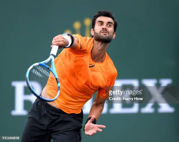 Yuki Bhambri of India serves in his match against Sam Querrey of the United States during the BNP Paribas Open at the Indian Wells Tennis Garden on...